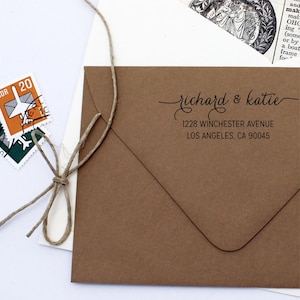 May include: A brown kraft paper envelope with a return address label. The label has the text "richard & katie" in cursive script, followed by the address "1228 Winchester Avenue, Los Angeles, CA 90045".