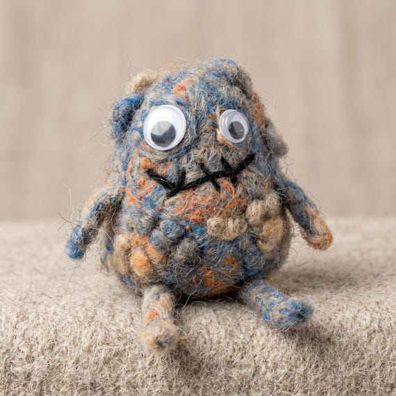 Needle felting a whole expressive goblin creature from raw wool is genuinely slow, skilled craft — each one is truly one-of-a-kind and deeply weird in the best way.