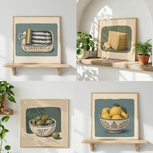 May include: A set of four square wall art prints featuring illustrations of food items: a tin of sardines with text, a wedge of parmesan cheese, a bowl of green olives, and a bowl of yellow lemons, each displayed in a simple wooden frame.