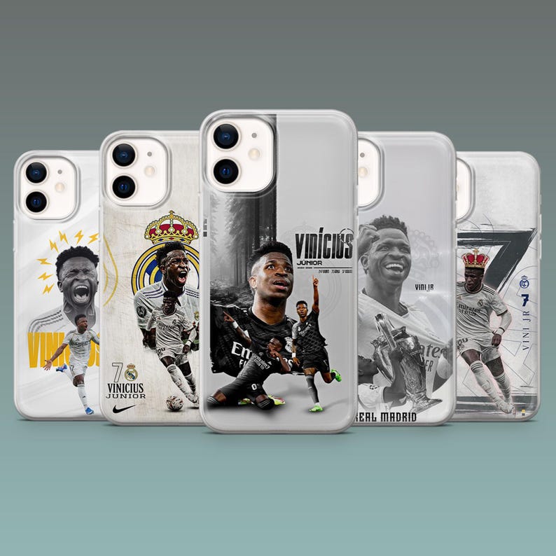 May include: Five clear smartphone cases featuring graphic prints of soccer player Vin&iacute;cius J&uacute;nior in various poses and Real Madrid team branding. The designs include black and white photography, yellow lightning accents, and the text Vin&iacute;cius J&uacute;nior.