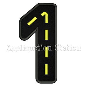 May include: Black leather patch shaped like the number one with yellow lines down the center, resembling a road.