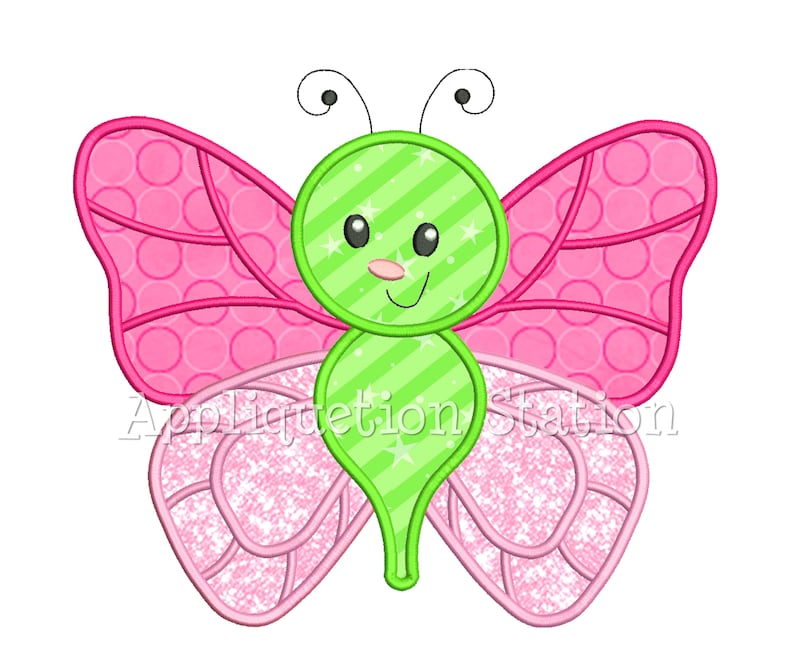 Puede incluir: Una mariposa verde con alas rosas y una cara linda. Las alas tienen un patr&oacute;n de lunares y brillo.