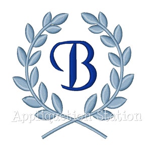 May include: A blue letter B surrounded by a wreath of light blue leaves. The text "Appliquétion Station" is below the wreath.