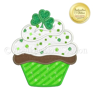 May include: A green and white cupcake with a shamrock on top. The cupcake is decorated with green shamrocks and white frosting. The cupcake is on a green and white striped background.