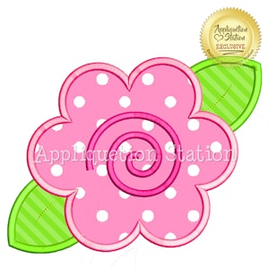 May include: A pink flower design with white polka dots and a spiral center. The flower has a scalloped edge and is accompanied by a green leaf with striped detailing. The text "Appliquetion Station" is visible on the flower.