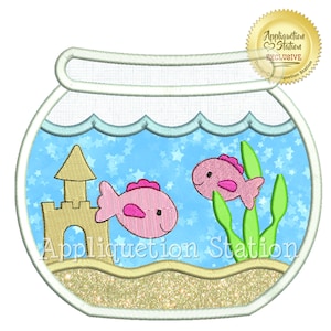 May include: An embroidered design of a fishbowl with two pink fish, a sandcastle, and green seaweed. The fishbowl is surrounded by a white border and the text "Appliquetion Station" is at the bottom.
