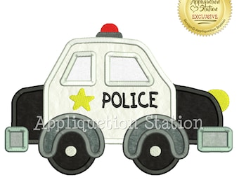 May include: White police car with a yellow star and the word "POLICE" on the side. The car has black wheels and a red light on top.