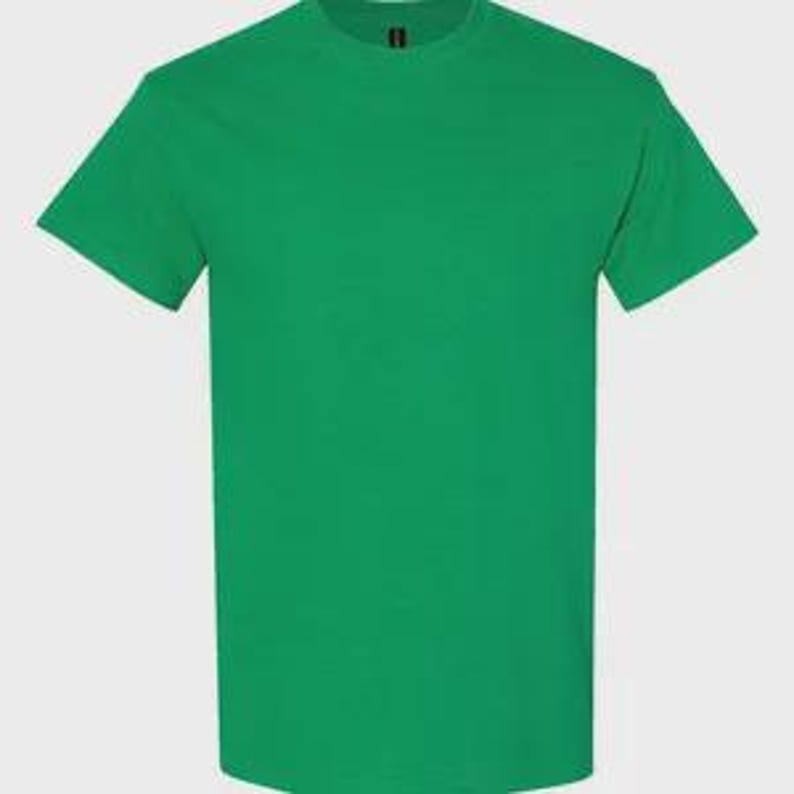 May include: A solid kelly green short-sleeved t-shirt with a crew neckline. The garment features a plain, unpatterned design with a standard fit, short sleeves, and a simple hemline at the bottom and on the sleeves. The fabric is a consistent green color.