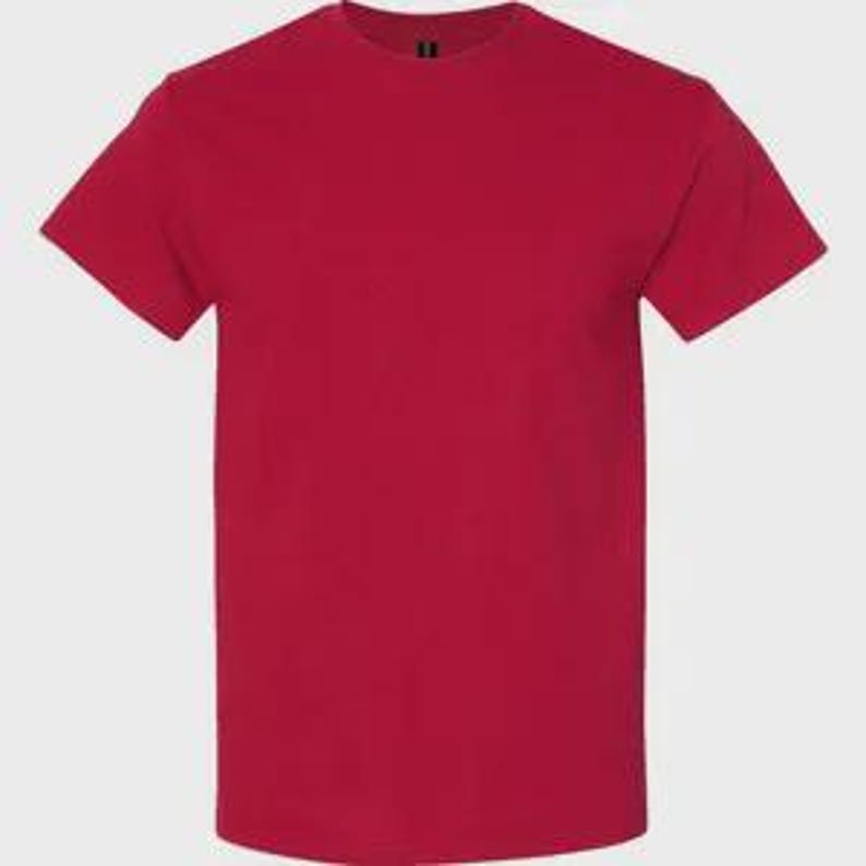 May include: A solid red short-sleeved t-shirt with a classic crew neckline. The garment features a plain, uniform color throughout, with a standard straight hemline and short sleeves that extend to the mid-bicep area, providing a simple design.
