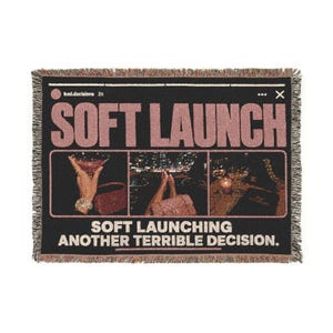 May include: A black woven throw blanket featuring the text SOFT LAUNCH in large pink letters. Below, three rectangular photo panels show a hand holding a cocktail, legs in a car, and a table setting. The text SOFT LAUNCHING ANOTHER TERRIBLE DECISION appears at the bottom.