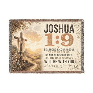 May include: A rectangular woven throw blanket featuring a landscape scene with a wooden cross on the left and the text JOSHUA 1:9 BE STRONG & COURAGEOUS. DO NOT BE AFRAID; DO NOT BE DISCOURAGED, FOR THE LORD YOUR GOD WILL BE WITH YOU wherever you go.