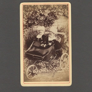 Outdoor CDV of Two Unhappy Twins in a Fancy Carriage