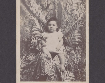 Cabinet Card of a Young Child with an Amazing Cloth Backdrop