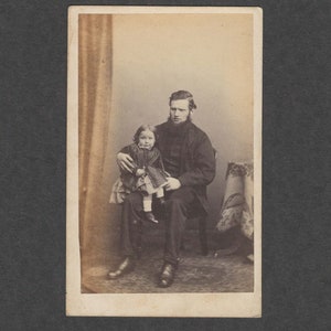 Amusing CDV of a Man Awkwardly Holding His Child
