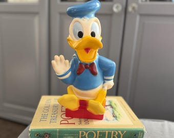 Vintage Donald Duck-muntbank met originele stop en label