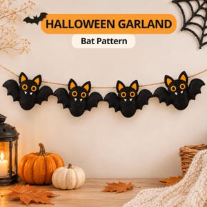 May include: A Halloween garland featuring four black felt bats with orange inner ears and yellow eyes, strung on a thin twine. The text HALLOWEEN GARLAND and Bat Pattern is displayed above the bats. The bats have small white fangs.