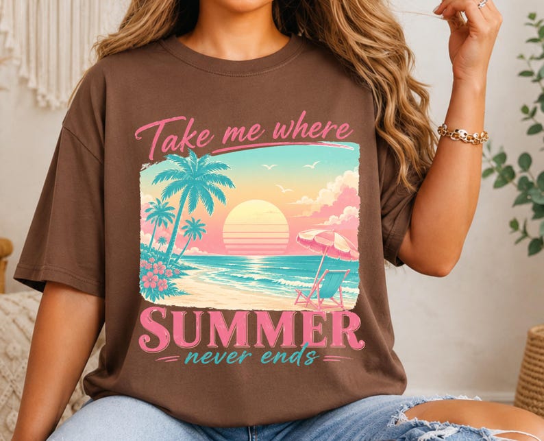 May include: A brown short-sleeve t-shirt featuring a graphic of a beach scene with palm trees, a sun, and a beach chair under an umbrella. The text "Take me where SUMMER never ends" is printed in pink and teal above and below the illustration.