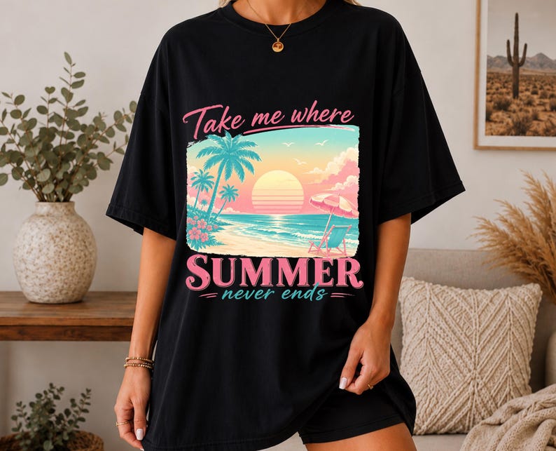 May include: A black t-shirt featuring a graphic print of a tropical beach scene at sunset with palm trees, a beach chair, and an umbrella. The text reads Take me where SUMMER never ends in pink and white lettering across the center of the shirt.