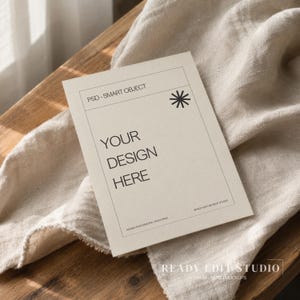May include: A rectangular off-white card mockup featuring a thin black border, a black asterisk symbol, and the text "PSD - SMART OBJECT", "YOUR DESIGN HERE", and "READY EDIT MOCKUP STUDIO" printed in black ink on the front surface.