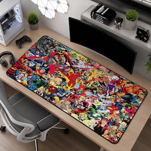 May include: A rectangular desk mat featuring a vibrant, multi-colored collage of various comic book superhero characters in action poses. The design covers the entire surface with detailed illustrations of figures in red, blue, yellow, and green costumes.