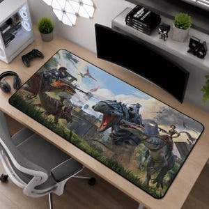 May include: A rectangular desk mat featuring a vibrant, detailed illustration of armoured dinosaurs and riders in a prehistoric landscape. The scene includes a large T-Rex, a triceratops, and various flying creatures, all rendered in shades of blue, green, and brown.