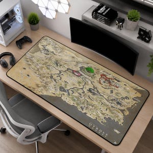May include: A rectangular desk mat featuring a detailed, beige-toned map of Hyrule. The surface displays various geographical landmarks, including mountains, forests, and water bodies, with the text The Legend of Zelda Hyrule printed in the bottom corner.