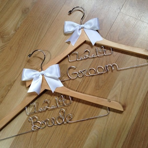 Beautiful BRIDE and GROOM with WEDDING date hanger set... The ultimate wedding/engagement/bridal shower gift that will be treasured forever.