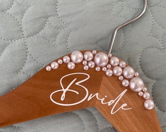 Gorgeous personalised pearl-kissed hangers custom made for you. White or ivory pearls to suit. Bride, Mrs or custom decal or keep blank.