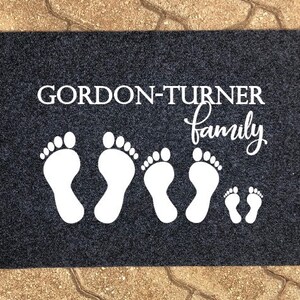 Family name with footprints doormat and custom names. Printed onto mat to last. Perfect gift for newlyweds, housewarming, birthdays, LGBTQ+
