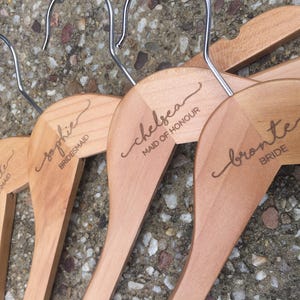 Lovestory name + title ETCHED coat hangers for the perfect wedding bridal party gift. Includes name and title etched. Perfect keepsake gift.