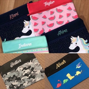 Personalised Pencil Cases for boys and girls. Awesome large 2 zip colourful designs with glitter or plain vinyl names. 34x26cm to fit it all