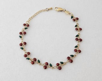 Bracelet cerise en acier inoxydable plaqué or