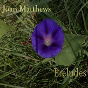 May include: A vibrant purple morning glory flower with a white centre, surrounded by green grass and leaves. The text "Joan Matthews" appears in the upper left corner, and the word "Preludes" is printed in the lower right corner in gold lettering.