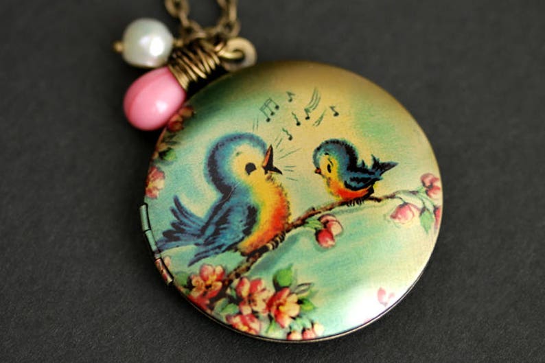 Singing Bird Locket Necklace. Cartoon Bird Necklace. Bluebird Necklace with Pink Teardrop and Fresh Water Pearl Charm. Bronze Locket. image 1