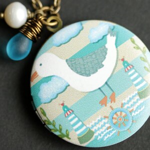 Seagull Locket Necklace. Nautical Necklace. Beach Bird Necklace with Bright Aqua Teardrop and Fresh Water Pearl Charm. Bronze Locket.