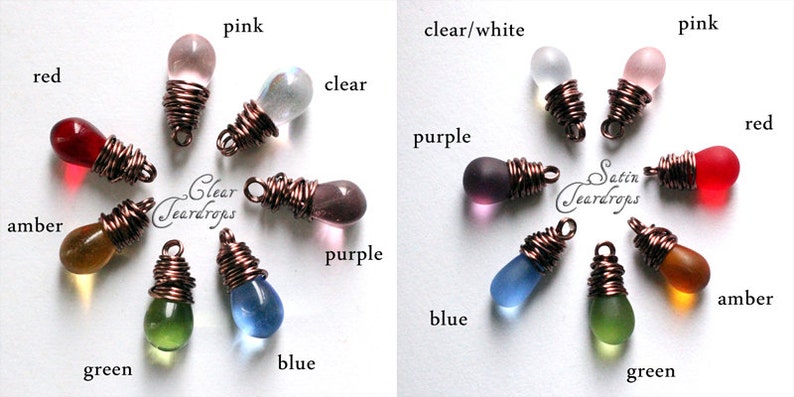 May include: Assortment of glass teardrop beads wrapped in copper wire. The beads are in various colors, including red, pink, clear, amber, green, blue, and purple. The text "Clear Teardrops" and "Satin Teardrops" is visible on the image.