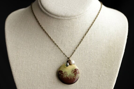 Amazon Jungle Locket Necklace. Amazon 