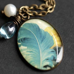 Blue Feather Necklace. Plume Feather Pendant with Light Blue Teardrop and Fresh Water Pearl. Charm Necklace. Bronze Necklace.