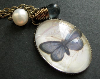 Butterfly Necklace. Montana Blue Butterfly Pendant with Pearl and Glass Teardrop. Handmade Jewelry.