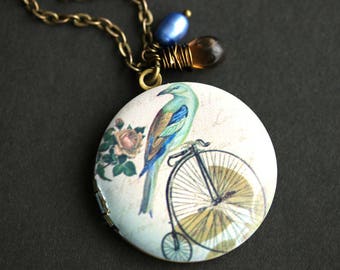 Bird on a Bike Locket Necklace. Green and Blue Bird Necklace with Brown Teardrop and Cobalt Blue Pearl Charm. Photo Locket.