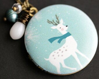 Winter Deer Locket Necklace. Holiday Deer Necklace with White Teardrop, Teal Fresh Water Pearl, and Clear Crystal Charms. Bronze Locket.