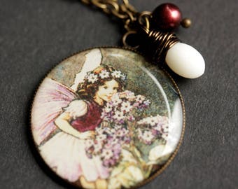 Smiling Fairy Necklace. Purple Fairy Pendant with White Coral Teardrop and Pearl. Charm Necklace. Purple Necklace. Bronze Necklace.