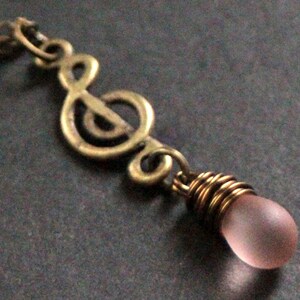 Music Necklace. Musical Note Necklace. Frosted Pink Teardrop Necklace. Treble Clef Necklace in Bronze. Handmade Jewellery.