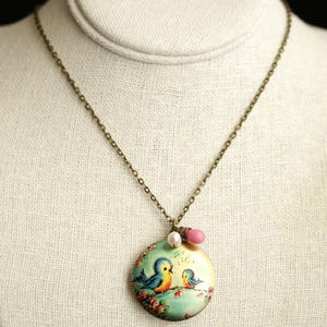 Singing Bird Locket Necklace. Cartoon Bird Necklace. Bluebird Necklace with Pink Teardrop and Fresh Water Pearl Charm. Bronze Locket. image 2