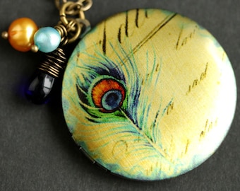 Peacock Feather Locket Necklace. Peacock Necklace. Feather Necklace with Cobalt Blue Teardrop and Pearl Charms in Orange and Aqua BLue.