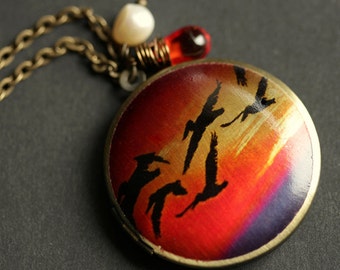 Bird Locket Necklace. Sunset Necklace. Bird Necklace with Orange Teardrop and Fresh Water Pearl Charms. Bronze Locket. Handmade Jewelry.