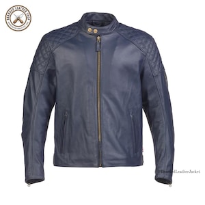 May include: A navy blue leather jacket featuring a stand-up collar with two snap buttons, a central metal zipper, and quilted diamond-patterned detailing on the shoulders. The jacket includes two zippered side pockets and long sleeves with zippers.