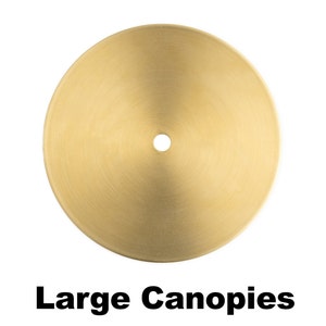 May include: A round, gold-colored metal canopy with a small hole in the center. Large Canopies.