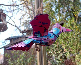 Bright pinks and blue botanicals patterns on purple - 3D paper bird