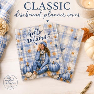 May include: A discbound planner cover featuring a blue and white plaid pattern with the text "hello autumn". The design includes a person wearing a blue sweater, scarf, and beanie, surrounded by blue and orange pumpkins and scattered autumn leaves.
